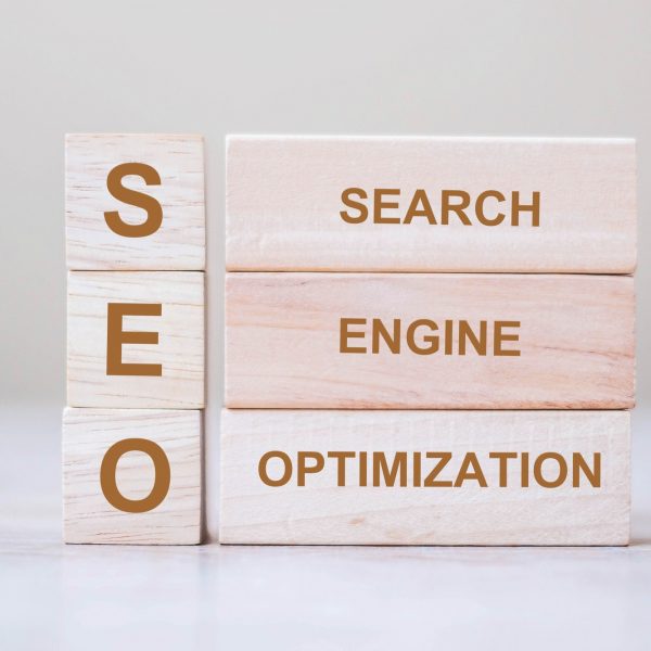 SEO (Search Engine Optimization) text wooden cube blocks on table background